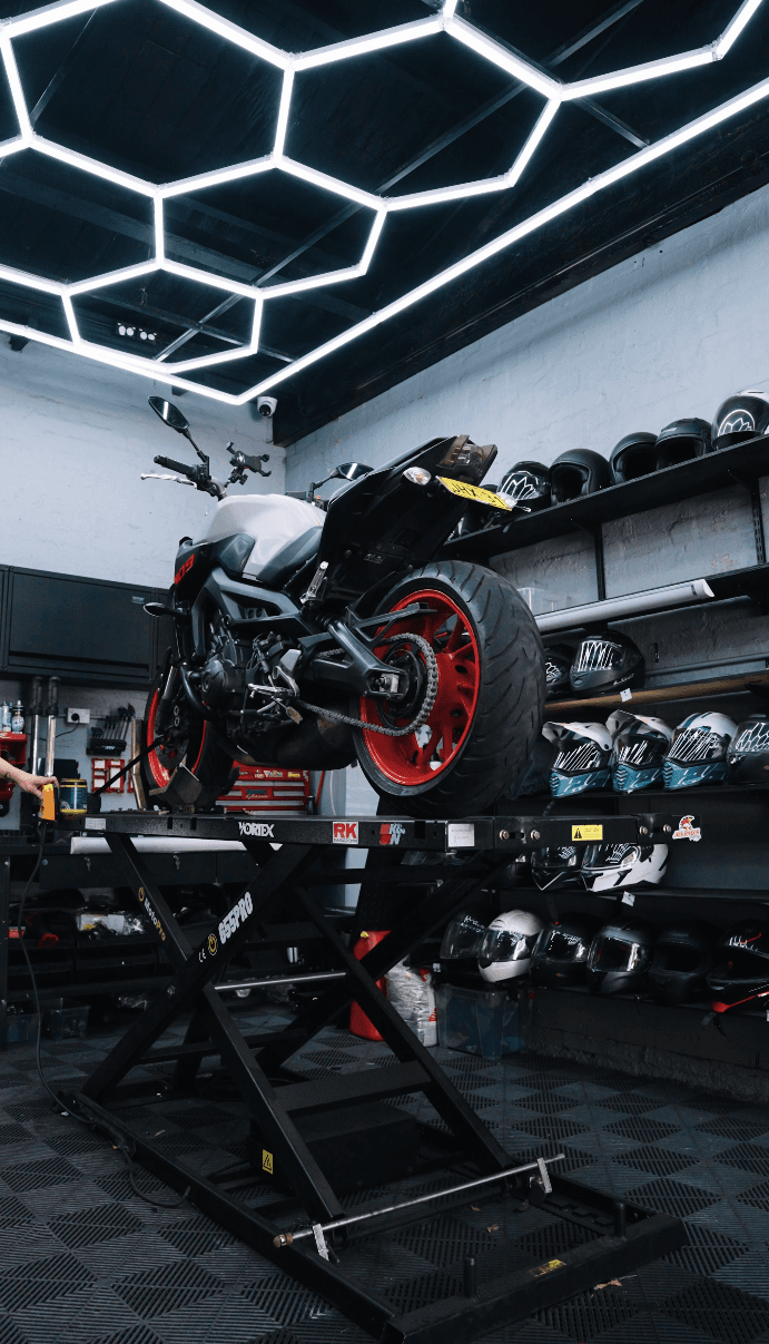 Motorcycle being serviced in the XPERT Moto workshop